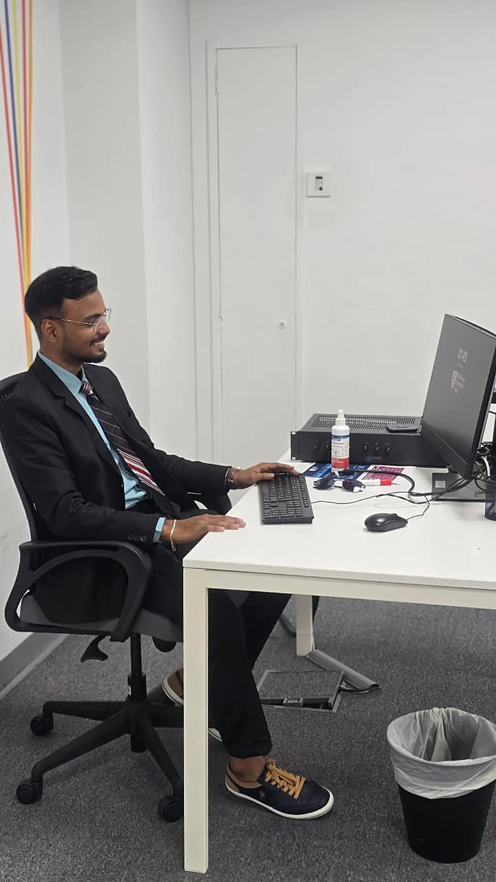 Amresh working at a computer